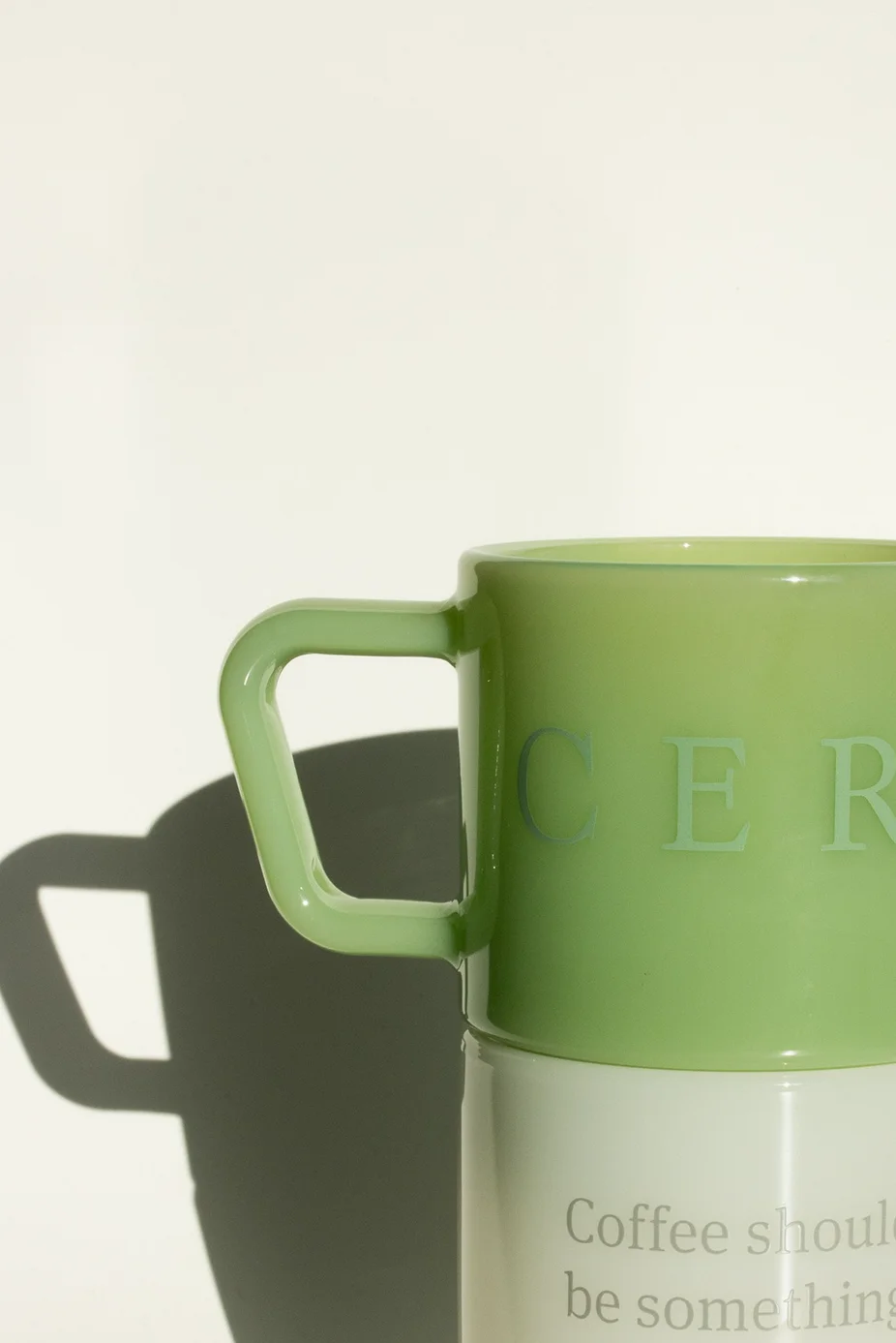 Ceremony Coffee Milk Glass Mugs in green (top) and white (bottom)
